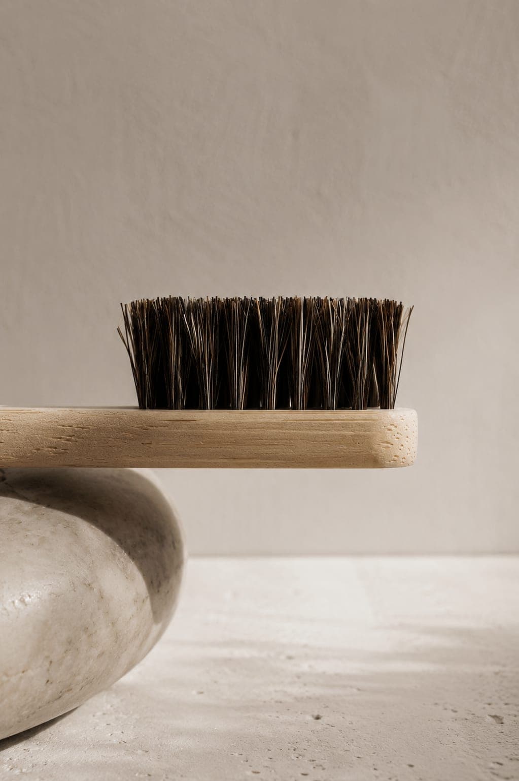 The bristle head of Toothbrush No. 01 — natural hair set in a bamboo handle, close up